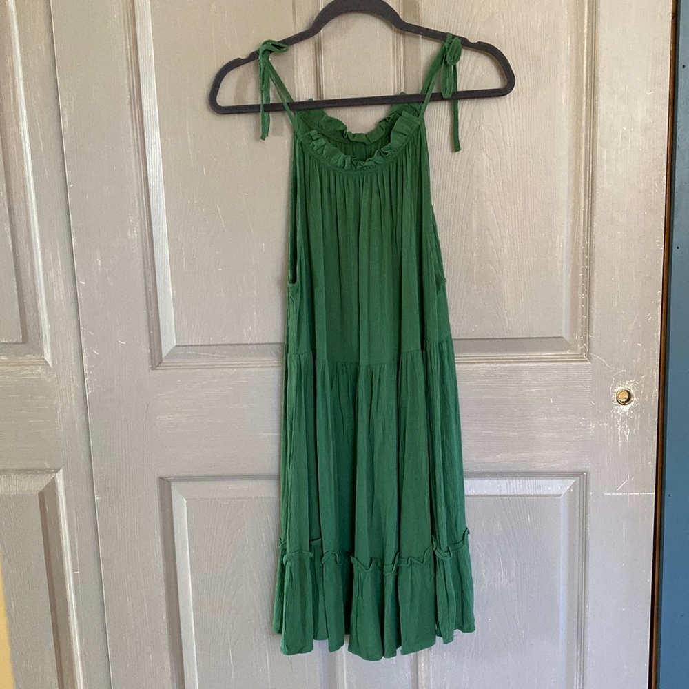 Green flowy dress with tie shoulder.